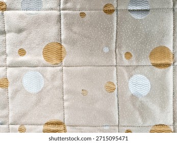 Abstract fabric texture with circular pattern and soft colors