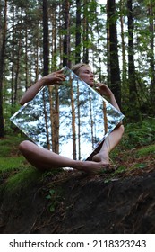 Abstract fashion portrait. Girl posing with mirror.