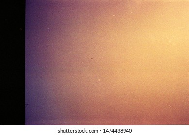 Abstract Film Texture Background With Grain, Dust And Light Leak