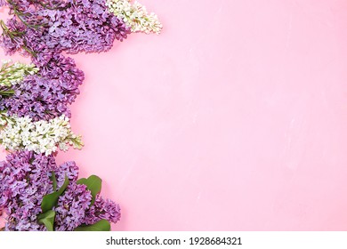 Abstract Floral Composition Flat Lay, Background, Spring Banner. Frame Made Of Lilac Branches On A Pink Table. Mothers Day Card, Womens Day, Happy Birthday, Wedding, Place For Text,