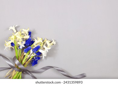 Abstract floral composition, still life, spring background or banner, Beautiful blooming hyacinths and muscari on a light background.holiday concept. Card for Mother's Day, Women's Day, 
