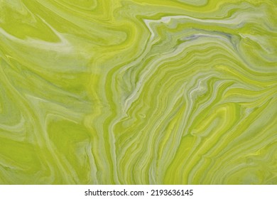 Abstract fluid art background green and gray colors. Liquid marble. Acrylic painting with olive gradient and splash. Watercolor backdrop with wavy pattern. Stone marbled section.