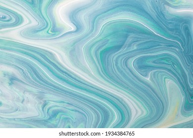 Abstract fluid art background light blue and cyan colors. Liquid marble. Acrylic painting on canvas with turquoise gradient. Watercolor backdrop with white wavy pattern. Stone section.