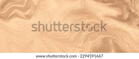 Abstract fluid art background light brown and bronze colors. Liquid marble. Acrylic painting on canvas with beige shiny gradient. Alcohol ink backdrop with pearl wavy pattern.