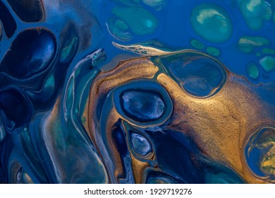 Abstract fluid art background navy blue and golden colors. Liquid acrylic painting on canvas with sapphire gradient and splash. Watercolor backdrop with bronze waves pattern. - Shutterstock ID 1929719276