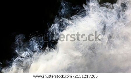 Abstract fog. White cloudiness, mist, or smog moves on black background for your logo wallpaper or web banner.