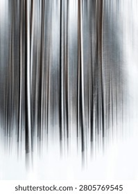 Abstract forest art featuring vertically blurred tree trunks in a winter scene, portraying movement and a serene, minimalist environment