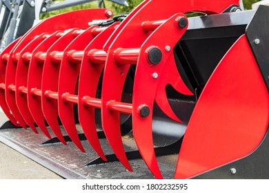 Abstract Fragment Of Red And Black Details Of Large Equipment For Agriculture. Heavy Machinery Abstract Background.