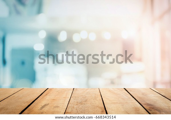 Abstract Front blur wood texture table bar\
view on clean terrace office window background content for\
christmas breakfast scene, modern interior grocery shop summer\
light blue pastel color\
photography