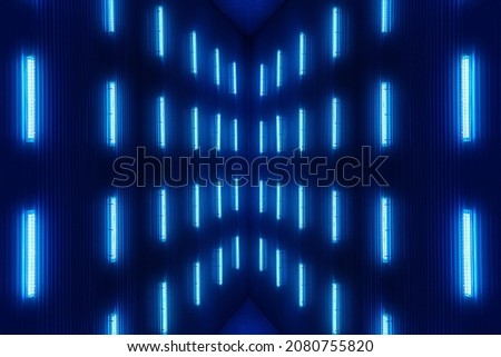 Abstract futuristic background. Blue glow from electric lamps. Neon light on dark background. Fluorescent ceiling lamps