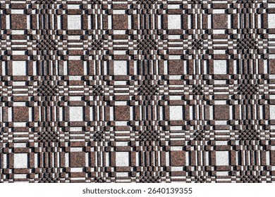 Abstract Geometric Grid Pattern with Textured Surface. A full-frame, repeating abstract geometric pattern composed of interlocking squares and rectangles in earthy tones of brown, gray, and white. 