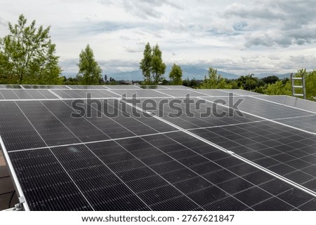 Abstract geometric pattern formed by solar panels, ideal as a background for renewable energy and technology concepts. Clean lines and modern structure representing sustainability and innovation.