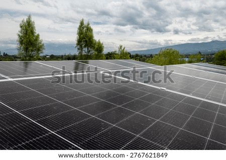 Abstract geometric pattern formed by solar panels, ideal as a background for renewable energy and technology concepts. Clean lines and modern structure representing sustainability and innovation.