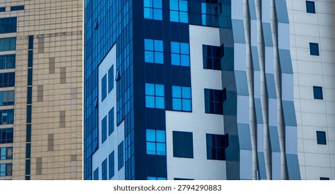 Abstract geometric pattern of modern skyscraper glass windows and futuristic building facade.