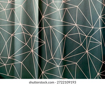 An abstract geometric pattern with thin rose gold lines on an elegant dark green background. The contemporary design with interconnected polygonal lines creates a dynamic yet orderly visual texture that gives a luxurious and modern feel.