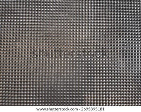 Abstract geometric texture with small cube pattern in gray tones. Modern metallic surface background with 3D depth and structured design.