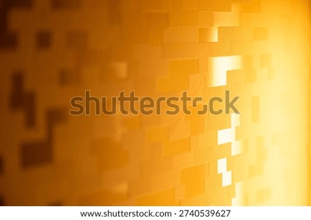 Abstract geometric wall pattern with warm golden light gradient. Modern 3D textured surface background with minimal block shapes, suitable for interior design, luxury branding, technology themes, and creative backdrops.