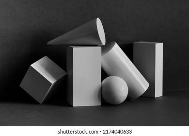 Abstract geometrical objects still life composition. Platonic solids figures geometry. Three-dimensional rectangular prism, cylinder pyramid cube, sphere on black gray background - Shutterstock ID 2174040633