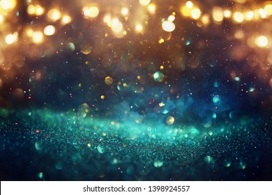 Abstract Glitter Lights Background. Black, Blue, Gold And Green. De-focused