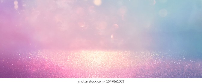 abstract glitter silver, gold , blue and pink lights background. de-focused. banner