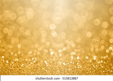 Abstract gold glitter sparkle confetti gala background or golden texture party invite for happy birthday, anniversary, wedding, new year’s eve or Christmas celebration