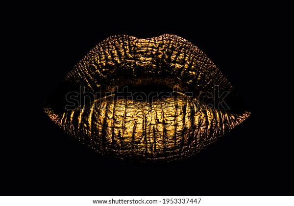 Abstract gold lips. Golden lips closeup. Gold metal\
art lip. Beautiful makeup. Golden lip gloss on beauty female mouth,\
closeup. Mouth Icon