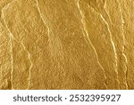 Abstract gold texture background with laser-etched rock wall, golden color, top view, close-up