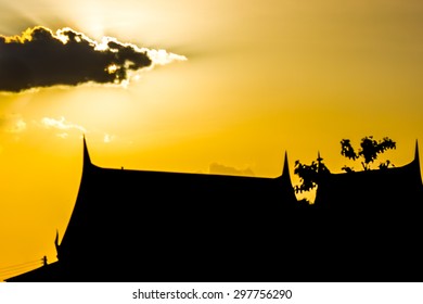 Abstract Of Golden Sunset Sky And Thai House Sillhouette