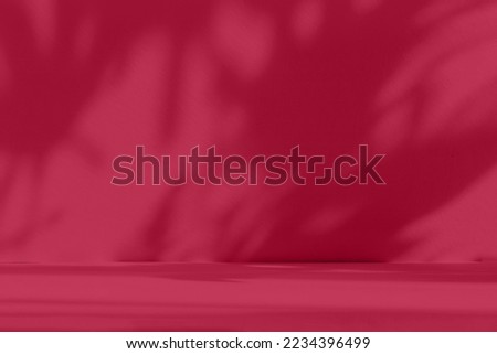 Abstract gradient blue studio background for product presentation. Empty room with shadows of window and flowers and palm leaves . 3d room with copy space. Trendy Color of the Year 2023 viva magenta
