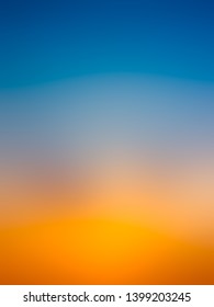 Abstract gradient sunrise in the sky and blue   orange natural background 