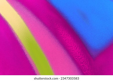 abstract graffiti background of urban aerosol painting pattern. Colorful artistic backdrop of city brush drawing lines on the wall
