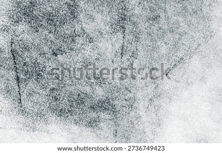 Abstract graphite texture on a light gray surface with natural pencil marks and subtle tonal variations. Neutral monochrome background suitable for design, print, and digital layouts.