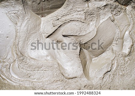 Abstract gray background. Texture of the cement mortar. Wet mixed mortar of cement and sand for construction work.