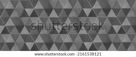 Abstract gray grey triangular cement concrete stone mosaic tiles, tile mirror or wallpaper texture with geometric hexagon triangles background banner panorama	