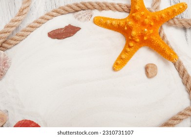 Abstract gray nautical background with starfish, shells and rope - Shutterstock ID 2310731107