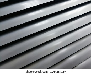 Abstract gray shutter fragment. Shutters on the window in the living room. Background texture.