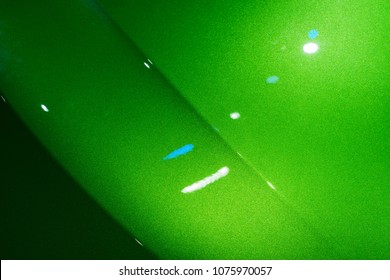 Abstract Of Green Car Front Hood Surface With Light Reflection And Lines