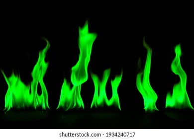 Abstract Green Fire Flames On Black Background.