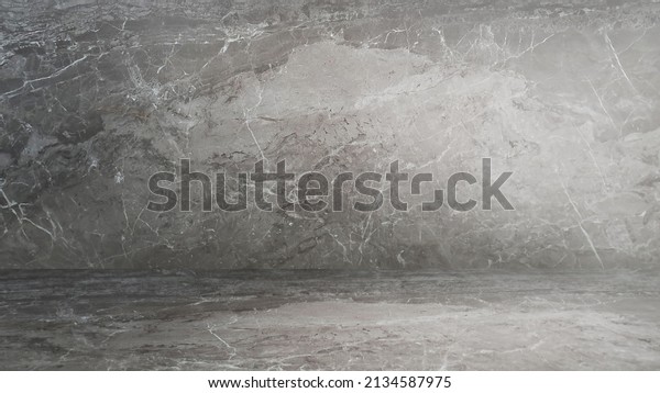 abstract grey marble texture in perspective view.\
empty room of luxury emperado marble finishing, wall and floor,\
with artificial light. indoor for products displayed (focus at\
center of image).