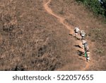 Abstract Groups of Porter or Sherpas while carrying the baggage of trekking up to the top of Doi Monjong the mountain in Chiangmai, Thailand, vintage tone for patient concept.