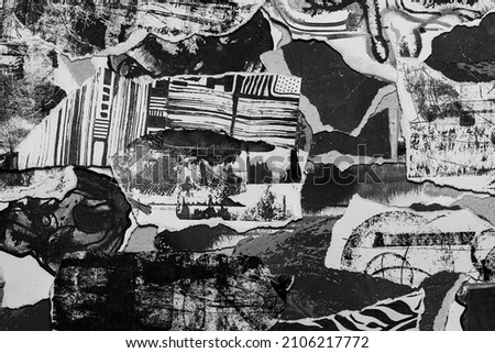 Abstract grunge black and white backdrop with scraps of paper and black paint spots. Torn paper texture and painting stains background.	