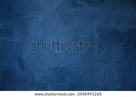 Abstract grunge blue navy Background, Texture. Beautiful empty stucco wall. Textured rough dark blue Surface. Creative Web banner or Wallpaper With Copy Space