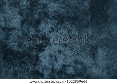 Abstract Grunge Decorative Dark Blue Grey stucco Wall Background. Gloomy Rough Smear Texture. Web Banner or Wallpaper With Copy Space For Design
