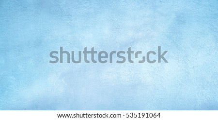 Abstract Grunge Decorative Light Blue Plaster Wall Background with Winter Pattern. Rough Stylized Texture Wide Screen With Copy Space for Design. 