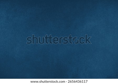 Abstract grungy texture background with different shades of dark matte blue color. Painted canvas, concrete surface, studio backdrop, grainy textured effect