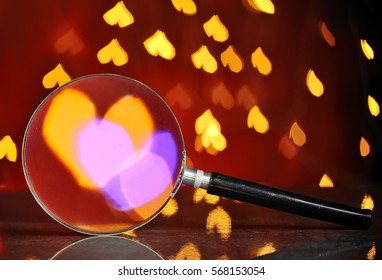 Abstract heart bokeh through magnifying glass.Concept of love, Valentine, soul mate, destiny. - Powered by Shutterstock