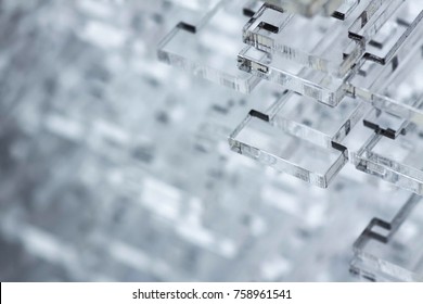 Abstract high-tech background. Details of transparent plastic or glass. Laser cutting of plexiglass.