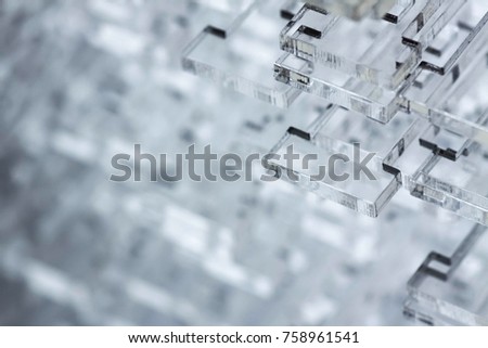 Abstract high-tech background. Details of transparent plastic or glass. Laser cutting of plexiglass.