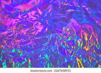 Abstract holographic background in 80s, 90s style. Modern bright neon colored metallic psychedelic holographic foil texture. Synthwave, vaporwave, retrowave, retro futurism, webpunk, syberpunk