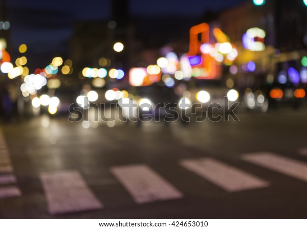 An abstract,\
horizontal image of a cross walk and traffic in a busy city. Could\
be any city, in this case, Nashville, TN. This is Broadway street\
in downtown Nashville. 